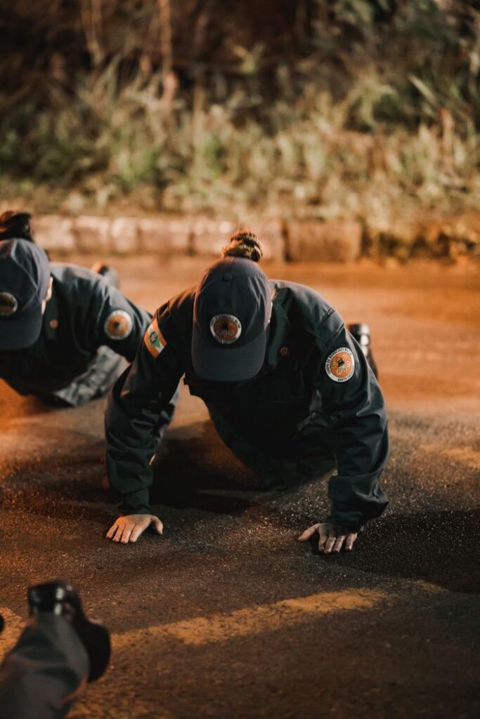 Police officers engaged in intense training exercises during the night.